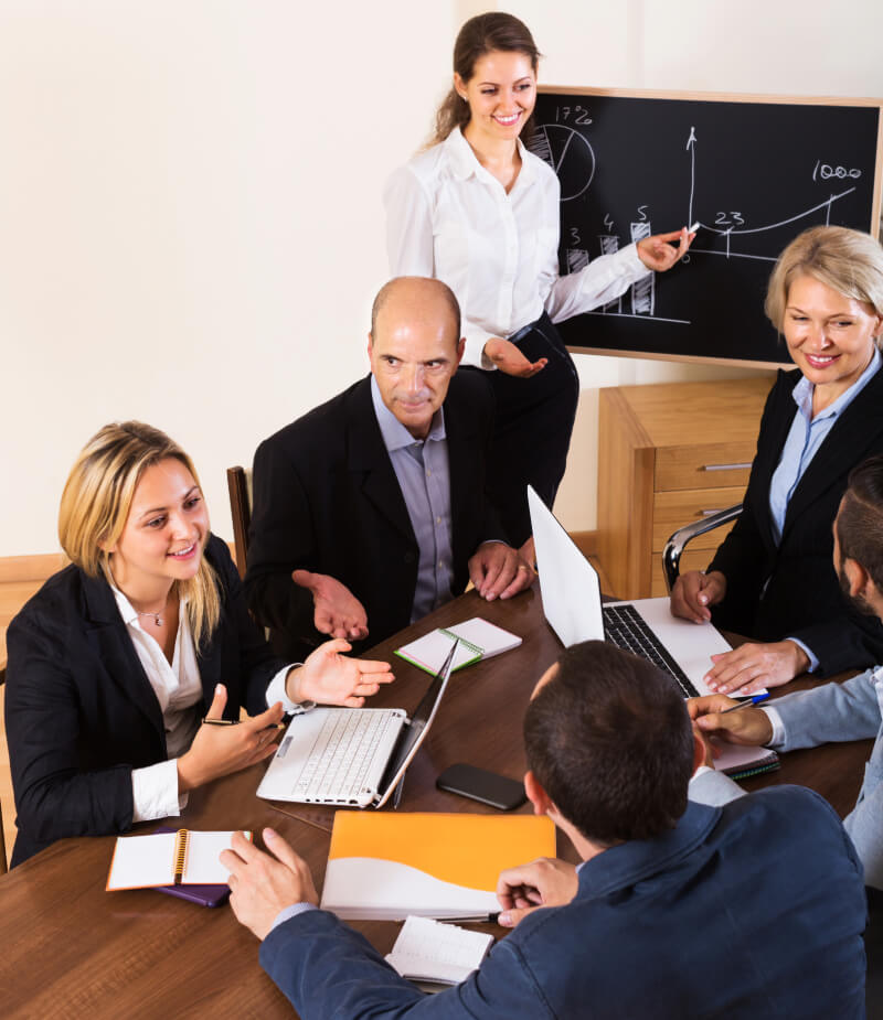 Business team using a business phone system to conduct a meeting